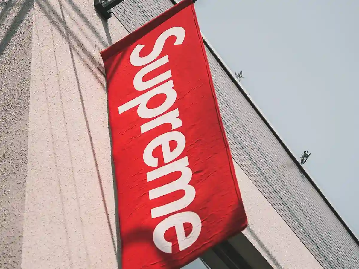 Close-up of scrim vinyl banner material showing mesh reinforcement, grommet detail and print quality